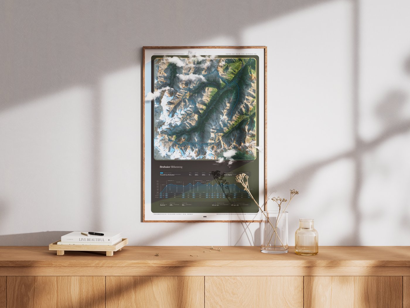 Stubaier Höhenweg poster framed in oak, hanging in a bright modern living room above a wooden sideboard